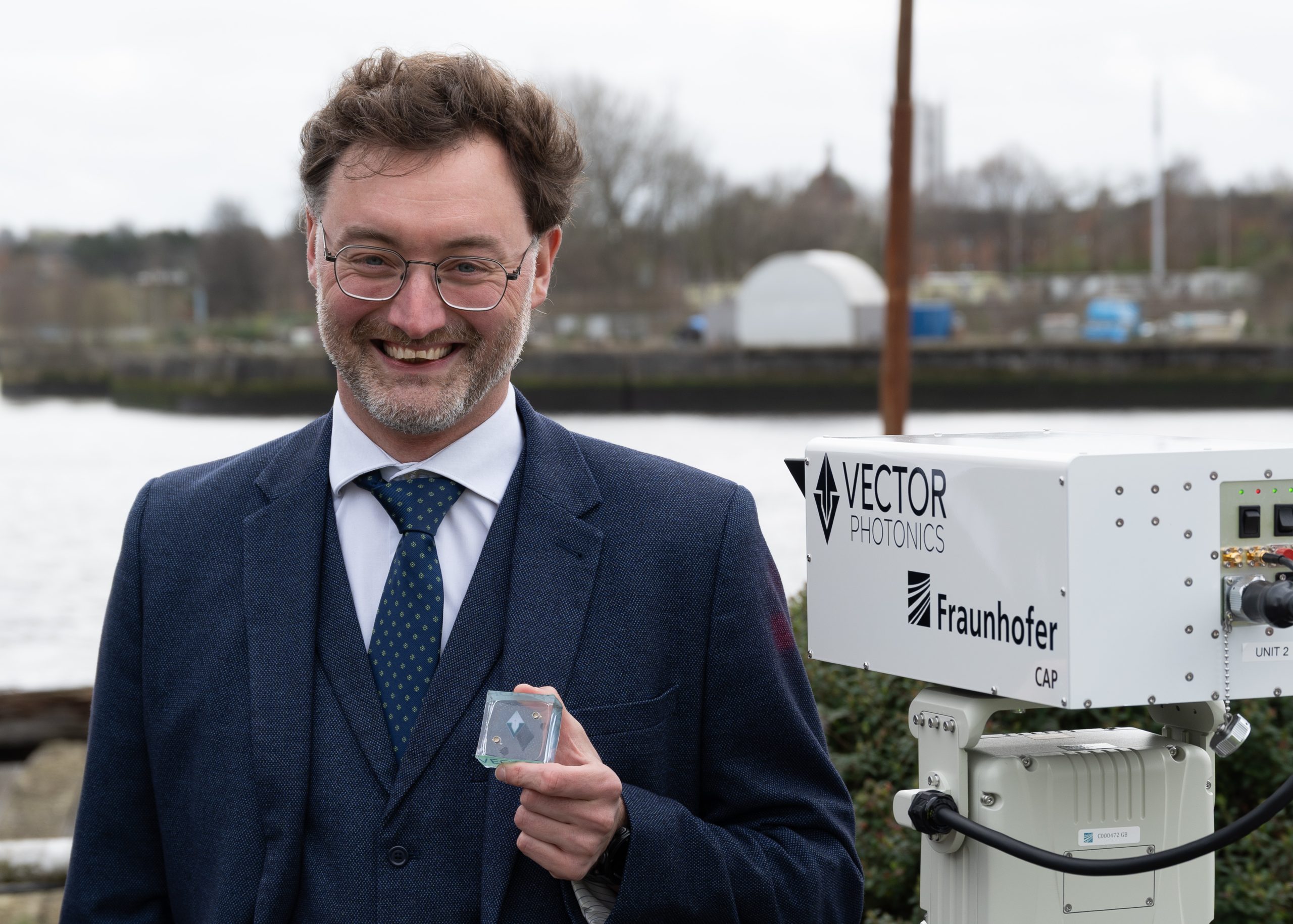 Photo caption : ‘Dr Richard Taylor, CEO and Founder of Vector Photonics, with the PCSEL and optical communications system at the successful demo across the Clyde.’
